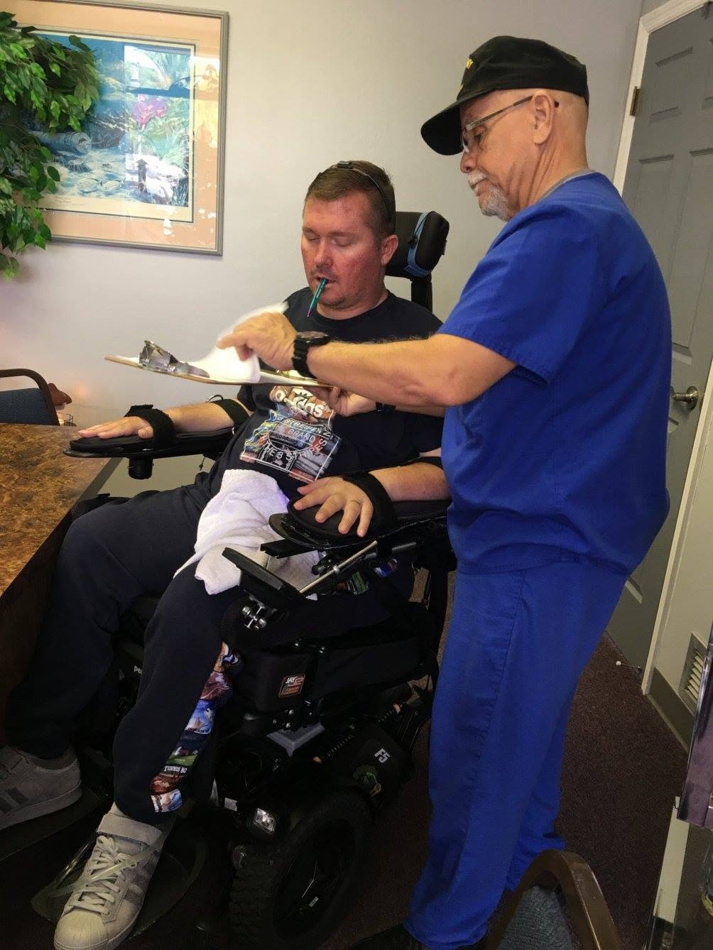 Johnny assisting Charlie during an everyday caregiver-supported living routine.