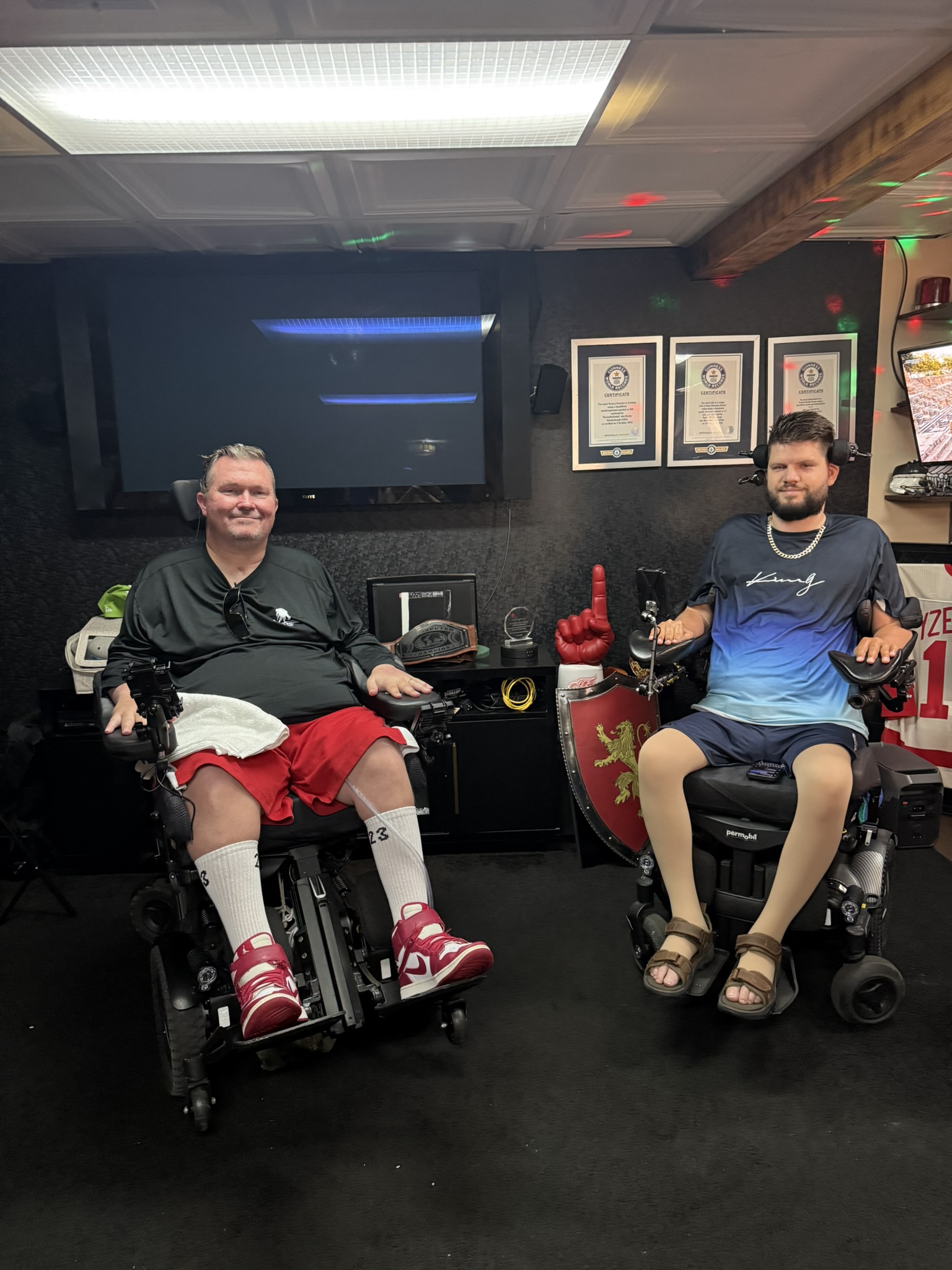 Charlie Merritt and Rocky No Hands together in their power wheelchairs during the National Veterans Wheelchair Games trip to Detroit.