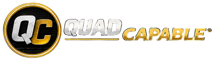 QuadCapable logo featuring the QC emblem in blue and silver, representing accessibility, assistive technology, independence, and life after paralysis.