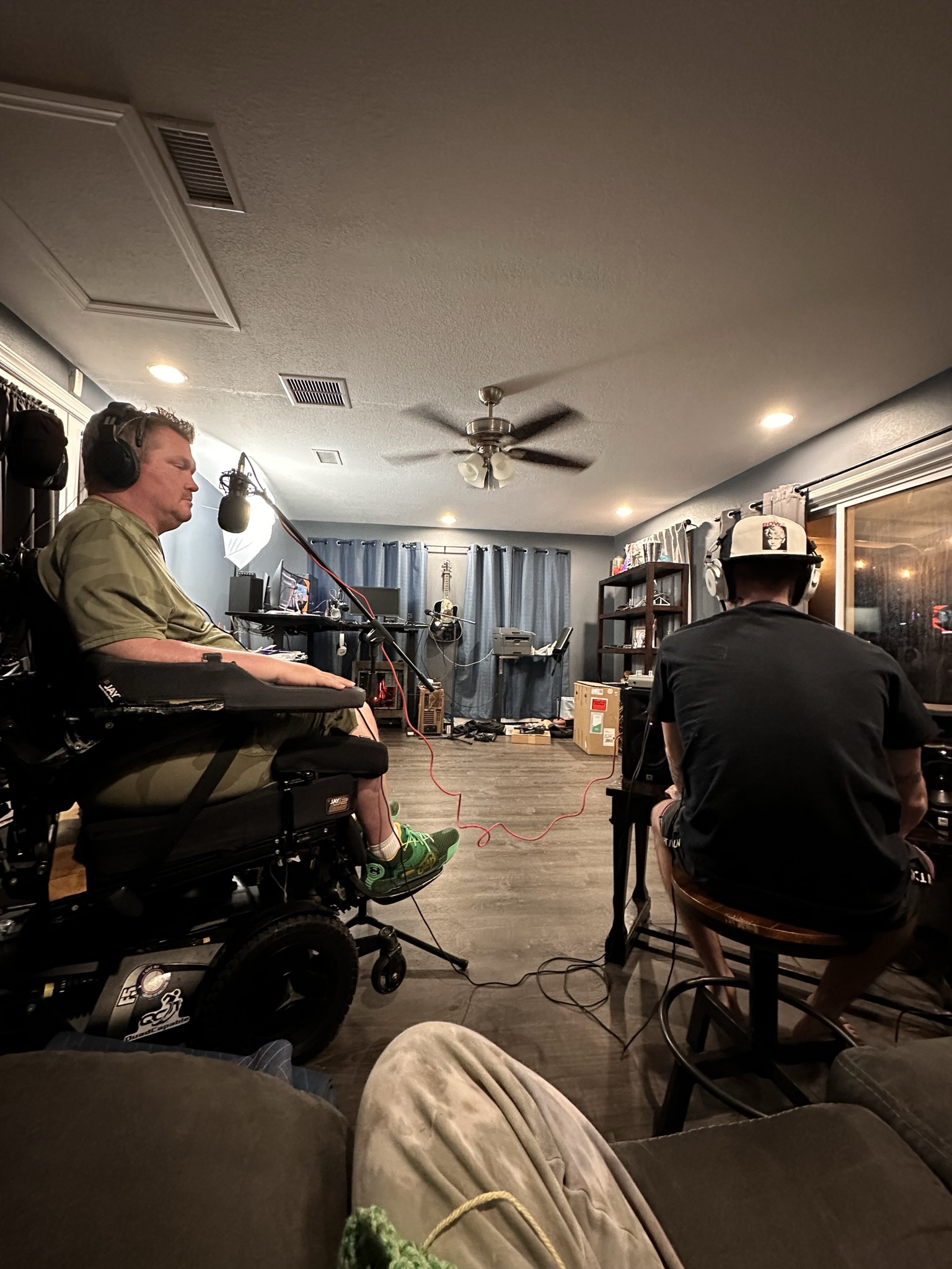 Wheelchair user participating in an indoor meeting with other people.